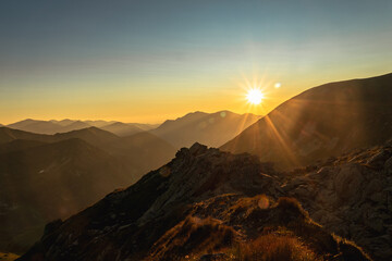 Sunset over the rocky peaks in the High Tatras