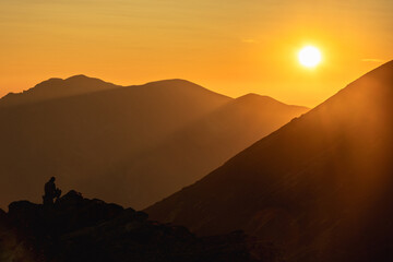 Sunset over the rocky peaks in the High Tatras