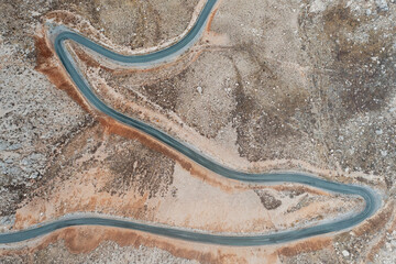 Aerial view of a road crossing the Nemrut mountains in autumn with clouds, Mount Nemrut, Turkey