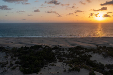Beach and waves from top view. Turquoise water background from top view. Summer seascape with dunes from air. Top view from drone. Travel concept and idea