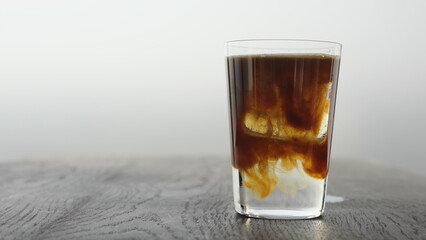 Making espresso tonic in tumbler glass
