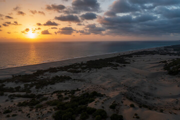 Beach and waves from top view. Turquoise water background from top view. Summer seascape with dunes from air. Top view from drone. Travel concept and idea