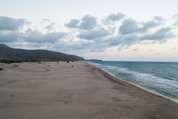 Beach and waves from top view. Turquoise water background from top view. Summer seascape with dunes from air. Top view from drone. Travel concept and idea