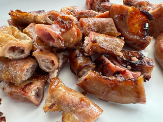 Thai grilled intestines pork, which is an Isaan food usually eaten with spicy dipping sauce and sticky rice, and popularly sold in Somtam shops. Street fast food menu in Thailand