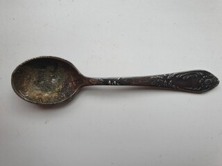 Vintage cupronickel spoon with wave texture.