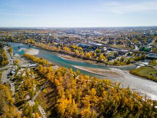 St. Patrick's Island Park and Bow River aerial view in autumn season. Fall foliage in City of Calgary, Alberta, Canada.