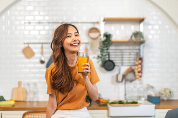 Portrait of beauty healthy asian woman making orange fruit smoothie with blender.girl preparing cooking detox cleanse with fresh orange juice in kitchen at home.health, vitamin c, diet, healthy drink - obrazy, fototapety, plakaty