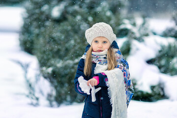 Girl in a snowy winter park