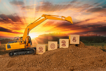 Concept Happy new year 2024,crawler excavator in construction site .on sunset  backgrounds