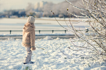 Girl  in a snowy winter park