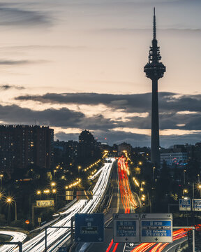 View of the highway from a bridge on the M30 in Madrid, long exposure photography and the Piruli of Torrespa&ntilde;a
