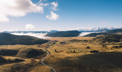 Fototapeta premium Aerial view of misty mountain in the morning