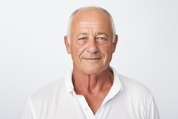 Obraz premium Portrait of a satisfied man in his 50s wearing a simple cotton shirt against a white background. AI Generation