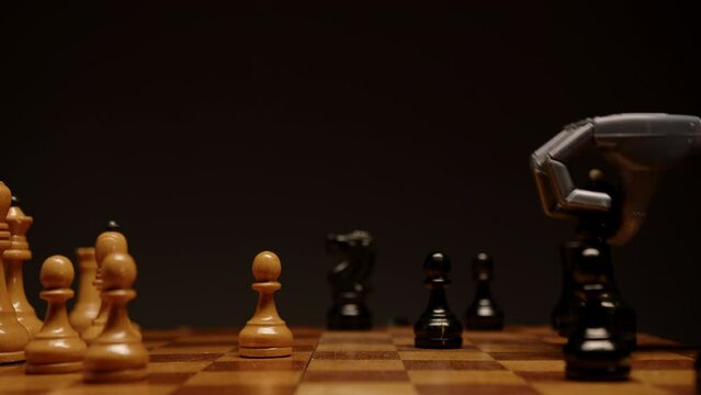 Robotic arm and human hand playing chess 