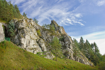 Fototapeta na wymiar Autumn landscape. A rock in an autumn forest