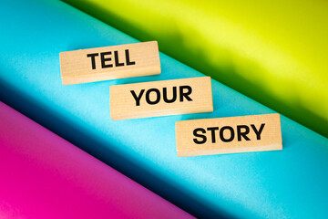Tell Your story symbol, Wooden blocks with words Tell Your Story. Beautiful multicolored...
