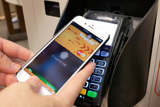 Motion of man using apple pay to pay foods at Mcdonalds restaurant