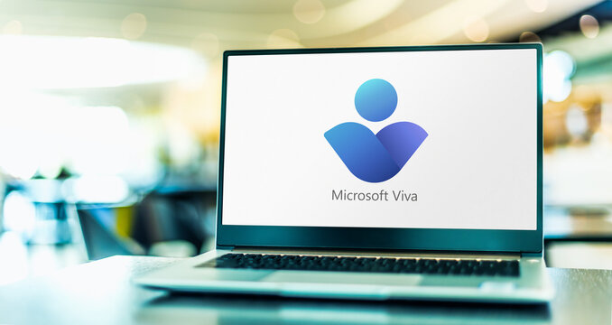 Laptop computer displaying logos of Microsoft Viva