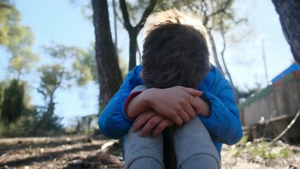 In the harsh reality of domestic violence, a young, bruised boy, potentially autistic, faces punishment in isolation, crying in fear. This poignant representation highlights the urgent need .