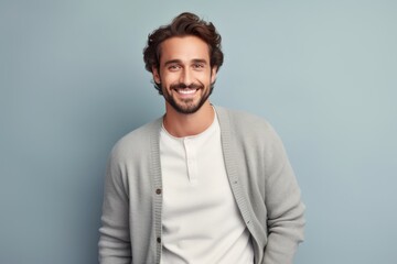 Fototapeta premium Portrait of a satisfied man in his 30s wearing a chic cardigan against a pastel gray background. AI Generation