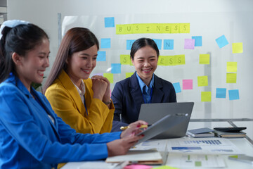 Asian business colleagues present and discuss investment project work and planning strategies....