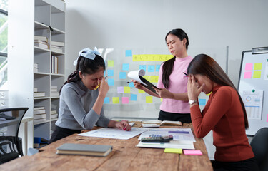A team of female office workers is stressed over finding solutions to problems in meeting documents. The head of the organization blames the work for being unsuccessful. Discussion concept improvement