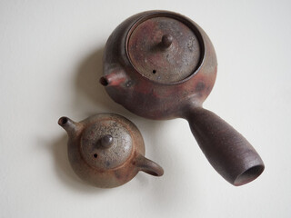 top view of traditional Japanese brown clay teapots with lids