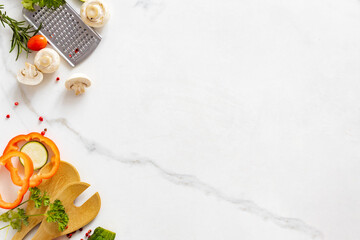 Cooking, menu background. Various vegetables and spices for preparation healthy food on white marble table with copy space top view