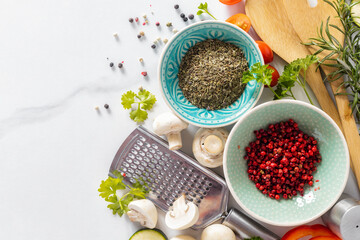 Cooking, menu background. Various vegetables and spices for preparation healthy food on white marble table top view