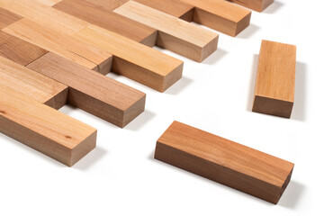 stacked wooden blocks on white. wood game jenga close up. wooden background close up.