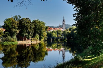 View of the church tower of Písek above the river Otava