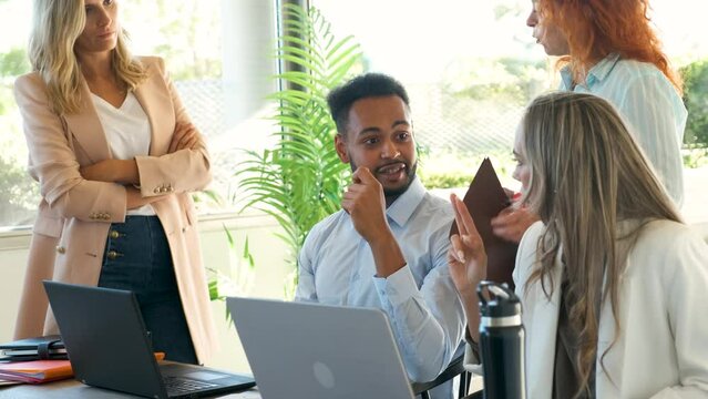 Multiracial business people discussing for project proposal or marketing at office.