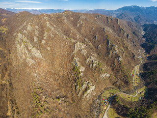 Aerial panorama of a rocky landscape - Calinesti valley is populated by massive, eroded cliffs rising up from the forest. Springtime season, Carpathia, Romania. © Alexandru V