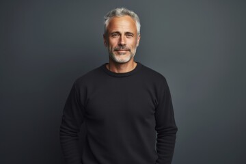 Naklejka premium Portrait of a glad man in his 30s wearing a thermal fleece pullover against a minimalist or empty room background. AI Generation