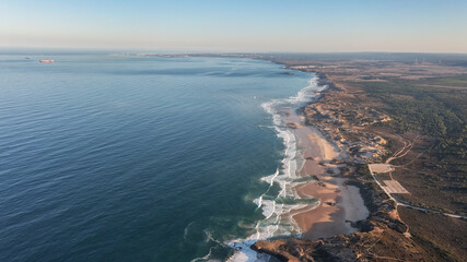 An aerial view of Malhao beach popular for surfing and vacationing tourists. Bird's eye view for...