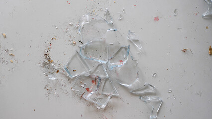 Close up of shattered glass lying on the floor - 680558407