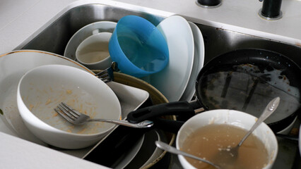 View of a sink full of dirty dishes - 680558609