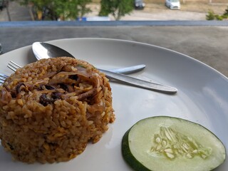 Fried rice the traditional food of Indonesia with lettuce. The photo is suitable to use for traditional food background, poster and food content media.