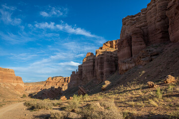 Fototapeta na wymiar Charyn Canyon is a canyon on the Sharyn River in Kazakhstan east of Almaty. Landscape on a clear sunny day in summer