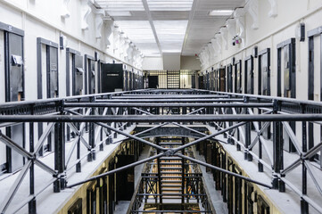 Cells and landing in the Crumlin Road Gaol, a Victorian built prison. - obrazy, fototapety, plakaty