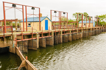 Wooden and metal locks at the River Bann, at the world's largest eel fisher, Lough Neagh, Northern Ireland.