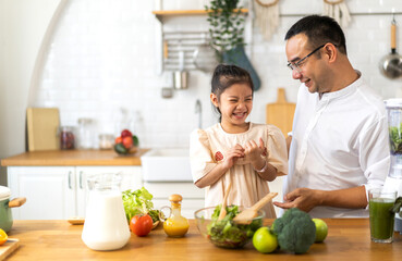 Portrait of enjoy happy love asian family mature father and little girl daughter smiling play laughing and having fun together.happy family and father's Day in moments good time at home