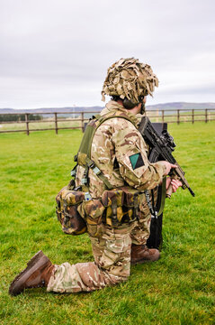 A soldier from the Royal Irish Regiment trains on a military firing range with an SA80 L85A2