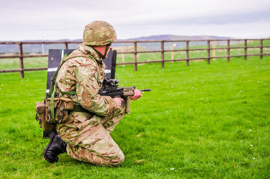 A soldier from the Royal Irish Regiment trains on a military firing range with an SA80 L85A2