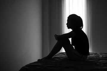 Young depressed woman, domestic and rape violence,beaten and raped sitting in the corner, Domestic...