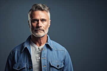 Obraz premium Portrait of a glad man in his 50s sporting a versatile denim shirt against a plain white digital canvas. AI Generation