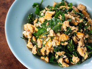 Bai Liang Pad Kai, stir fried Malindjo or Baegu leaves with egg, popular simple and delicious Thai southern dish
