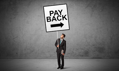 Obraz premium business person holding a traffic sign