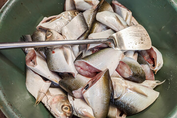 pieces of milkfish ready to be fried