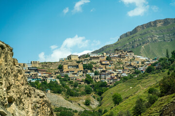 Fototapeta premium Chokhsky terraces Dagestan. Landscape of mountainous Dagestan with terraced fields and peaks mountains in the distance.